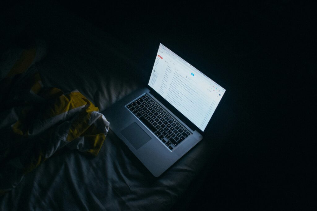 Laptop open late at night while waiting for feedback from ARC readers on a first novel