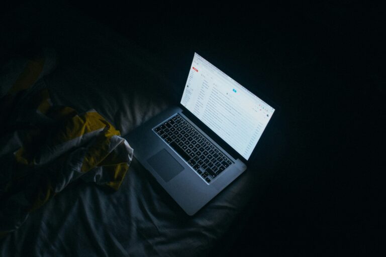 Laptop open late at night while waiting for feedback from ARC readers on a first novel