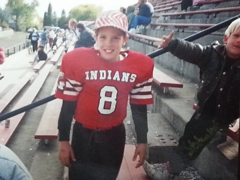 Childhood football photo from youth sports reflecting masculinity and emotional vulnerability in men